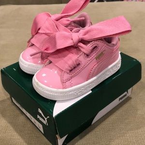 Puma pink patent sneakers